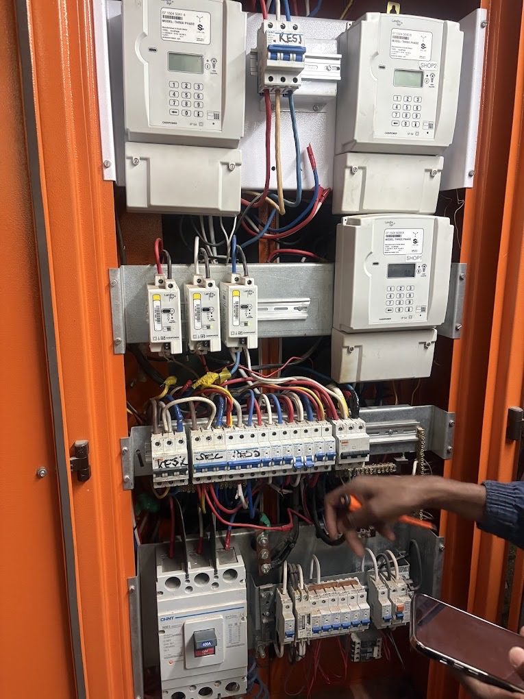Working inside a distribution board full of breakers