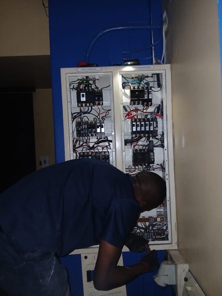 Wiring out a control panel on site.